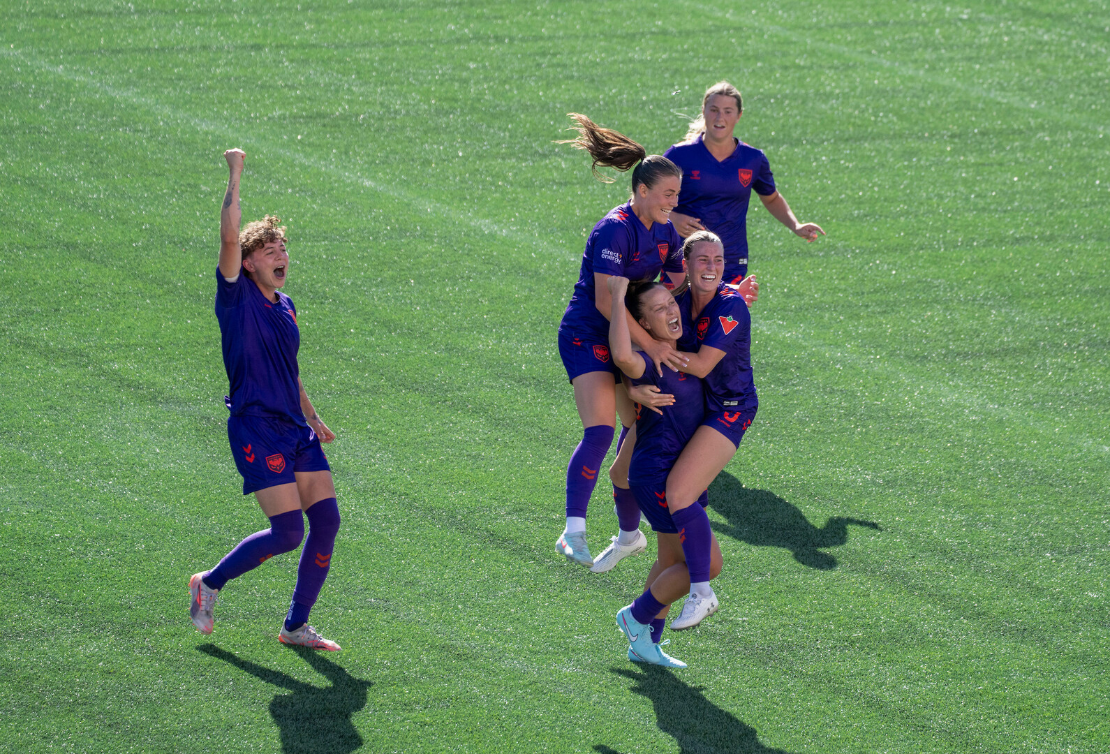 Meggie Dougherty Howard celebrating a goal with teammates